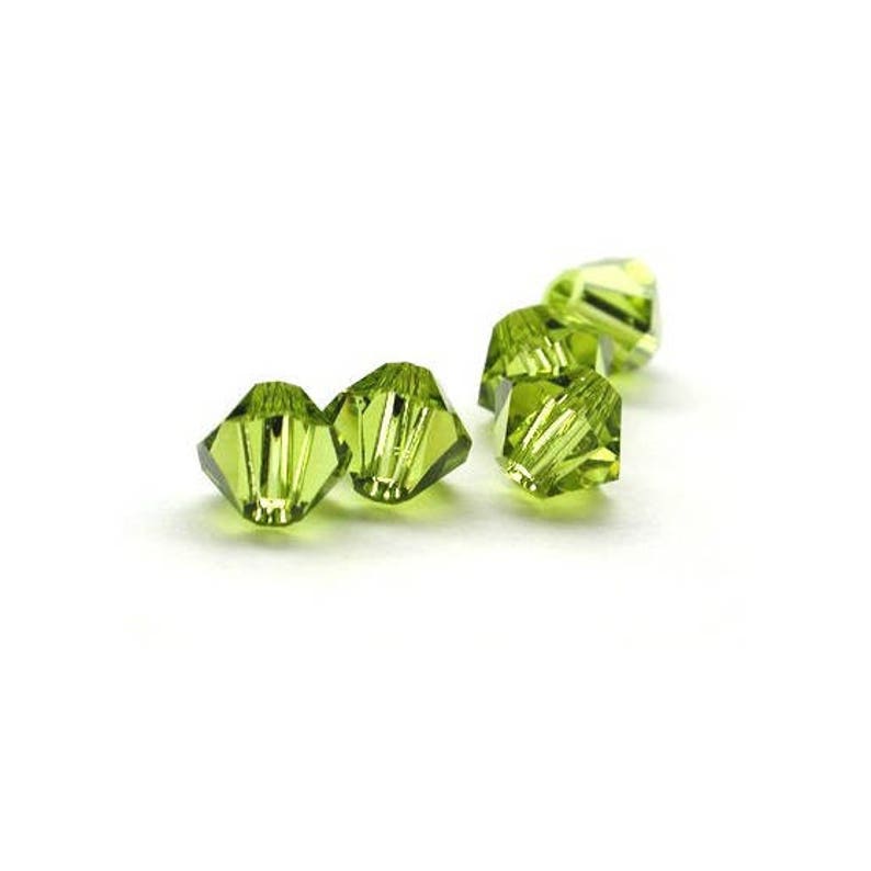 50 Pcs Perles toupies 5328 SWAROVSKI Olivine 4 mm image 1