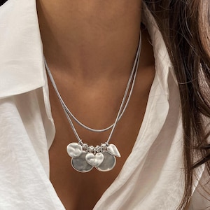 チェーン2個セット マルチコイン ハートネックレス• レイヤードラウンドディスク ハートフリルチョーカー• シルバースネークチェーン ハートネックレス by AnAngelsHug