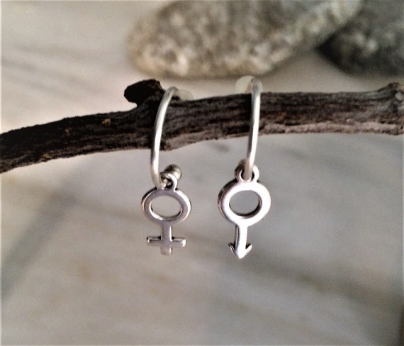 Female sign earrings clearance