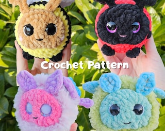 May include: Four crocheted stuffed toys with googly eyes. The toys are a bee, a ladybug, a pink and purple creature, and a blue and green creature. The text "Crochet Pattern" is visible in the image.