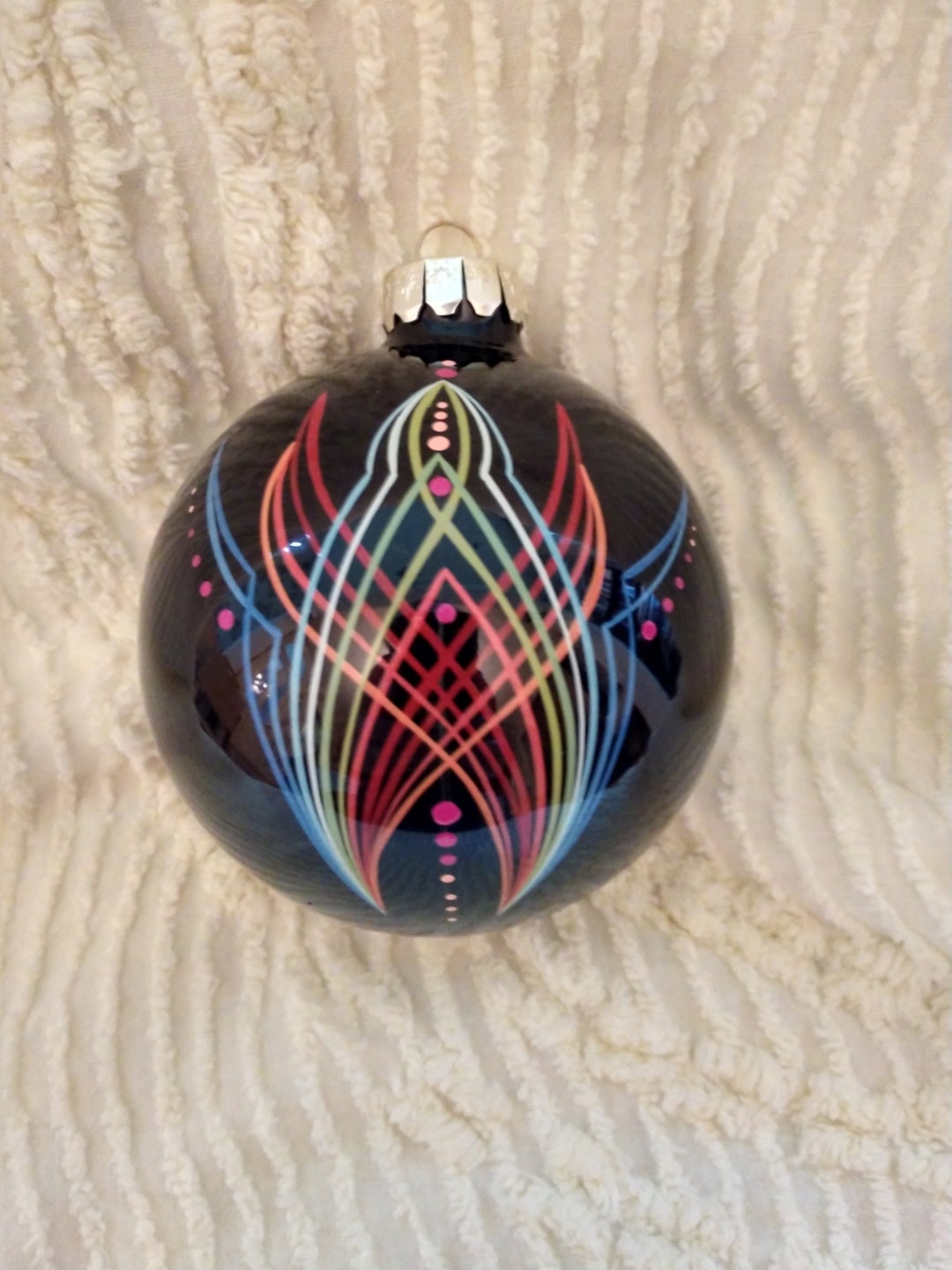 4 In. Shiny Black Glass Ornament With an Amazing Hand