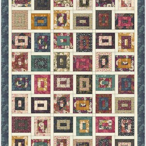 May include: A rectangular quilt featuring a grid of block patterns in various floral and paisley prints. The colours include shades of deep blue, mustard yellow, magenta, and cream. The quilt is framed by a dark blue floral border with corner accents.