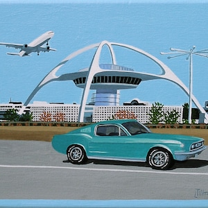 May include: A turquoise blue Ford Mustang driving past a white futuristic building with a white airplane taking off in the background.