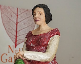 Paper mache sculpture, a sitting woman