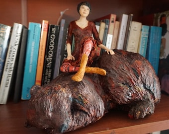 A woman and her bear, animal lover, paper mache sculpture