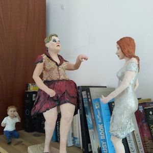 Paper mache sculpture, a family at the ballroom, dominating mother