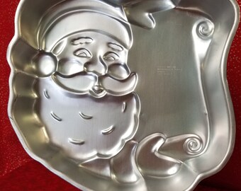 Santa head with scroll shaped pan