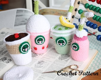 May include: Crocheted amigurumi food items, including coffee cups and drinks, in various colors. The items feature green and white logos, and some have decorative elements like strawberries and lemon slices. The phrase "Crochet Pattern" is visible.