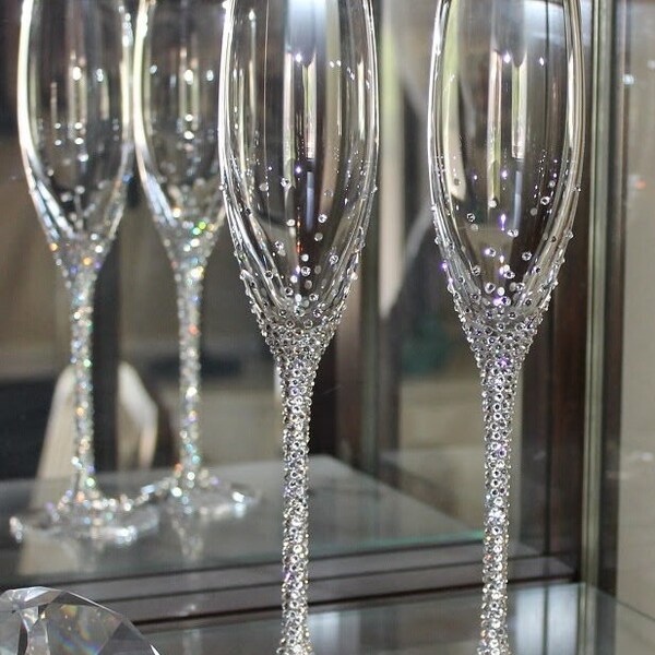 Blinged-out Gold or Platinum-rimmed Lenox Toasting flutes embellished with Swarovski Crystals. Champagne flutes.