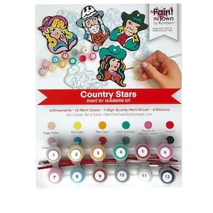 May include: Country Stars paint by numbers kit with four wooden ornaments, 12 paint colors, a paint brush, and four ribbons. The kit includes a variety of colors, including pink, blue, green, red, and black.