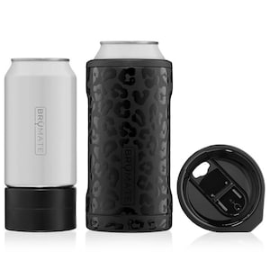 May include: A black and white leopard print insulated can cooler with a black lid and a matching black base. The cooler is made by the brand "BRÜMATE".