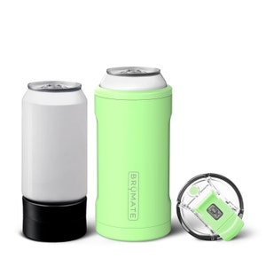 May include: Two stainless steel can coolers, one in white and one in green, with a clear lid with a green slider. The green cooler has the word "BRÜMATE" printed on the side.