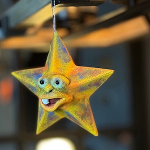 Ornamento stella in cartapesta unico nel suo genere