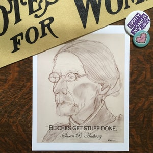 May include: A sepia-toned portrait of Susan B. Anthony with the quote "BITCHES GET STUFF DONE." printed below. A banner reading "VOTES FOR WOMEN" and two buttons that say "UPPITY WOMEN UNITE" and "FEMINIST" are also visible.