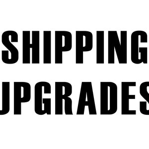 May include: Black and white text on a white background that reads "SHIPPING UPGRADES".