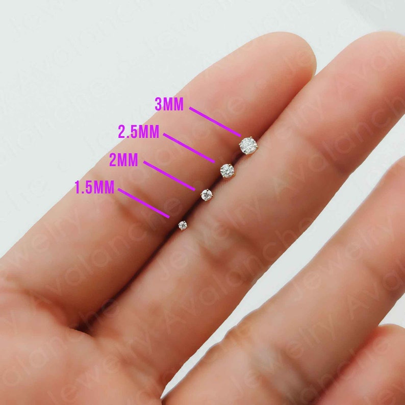 May include: Five clear round cubic zirconia stones of different sizes, ranging from 1.5mm to 3mm, are displayed on a finger. The stones are labeled with their size in millimeters.