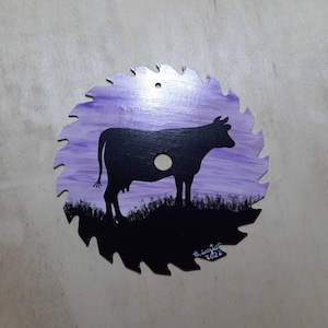 Hand painted saw blade acrylic painting cow on a hill
