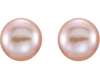 May include: A pair of pearl earrings in a soft pink color.
