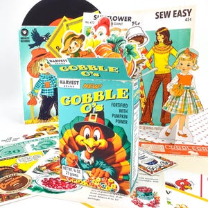 May include: A vintage-themed collection featuring a cereal box of "Gobble O's" with a turkey illustration, alongside retro paper cutouts of a scarecrow, a girl, and a woman. The image includes the text "Harvest Brand".