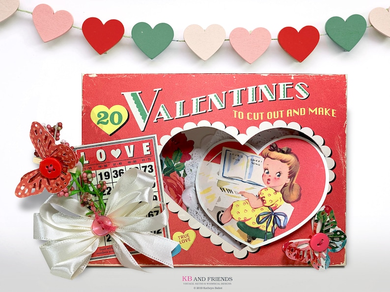 May include: A vintage Valentine's Day craft kit with a red cover and the text "20 Valentines to cut out and make". The kit includes a heart-shaped cutout with a girl playing the piano, a love bingo card, and a white satin ribbon bow.