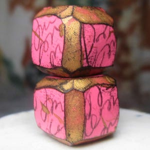 Polymer Clay Bead Pair - 2 Rustic Cubes - Script Scribbles on Pink w Beveled GOld Edges - Primitive Chunky Nuggets - 1006