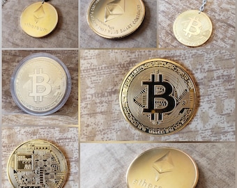 May include: A collection of gold-colored metal cryptocurrency tokens featuring Bitcoin and Ethereum designs. The items include a pendant on a black cord, a keychain, and individual coins, some encased in clear plastic, displaying embossed logos.