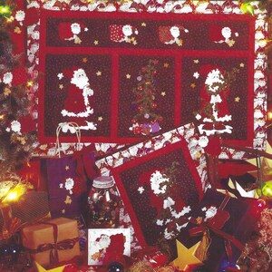 May include: A Christmas-themed arrangement with a patchwork quilt depicting Santa Claus and Christmas trees. The image includes gift boxes, star decorations, and the text "87901 TREE TRIMMING PARTY FIBER MOSAICS".