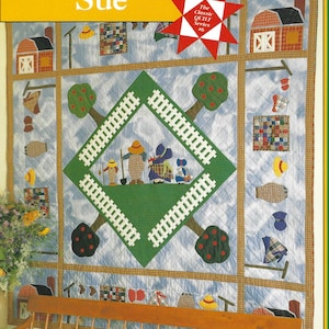 May include: A quilt pattern book cover titled Sunbonnet Sue, The Classic Quilt Series #6 by Laura Nownes. The cover features a blue and white sky-patterned quilt with a central green diamond, white fence, trees, and figures, framed by a brown border.