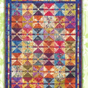 May include: A colorful quilt with a geometric pattern, featuring diamond shapes in various colors like orange, blue, purple, and yellow. The quilt is bordered with a dark blue fabric and has the text "Fat Quarter Stir Fry" at the top. Designed by Judy Reynolds.