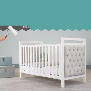 May include: White cot with a tufted headboard and a grey mattress. A paint roller is shown in the background with the word "Stencil" above it.