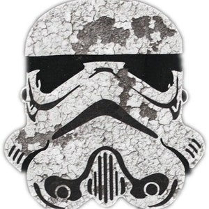May include: A white and black distressed Stormtrooper helmet design. The helmet is cracked and chipped, giving it a weathered look.