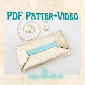 May include: A gold leather envelope clutch with a blue ribbon and scalloped edges. The text "PDF Pattern + Video" and "by Justyna Thread Made" is visible on the image.