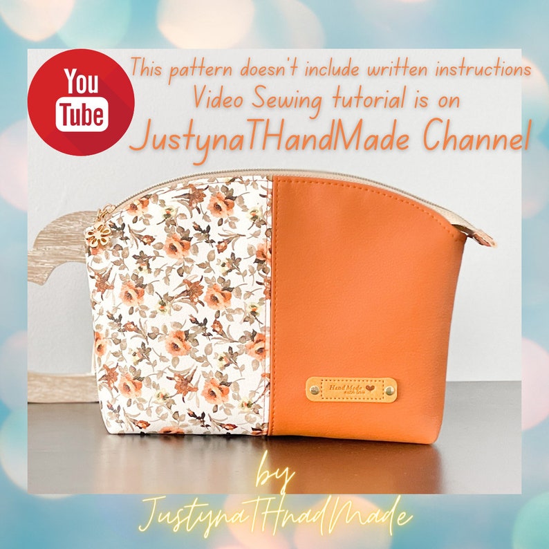 May include: A small orange and white zippered pouch with a floral print on one side and a solid orange color on the other side. The pouch has a gold zipper and a small brown leather tag that says "Hand Made with Love".