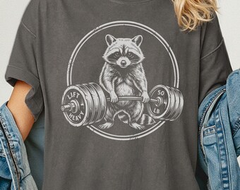 Camiseta de gimnasio con estampado de mapache levantando pesas, camiseta divertida para cubrir bombas de ejercicio, ropa deportiva con estampado de animales salvajes, levanta pesas