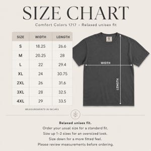May include: A size chart for a Comfort Colors 1717 relaxed unisex fit t-shirt. The chart lists sizes S through 4XL with corresponding width and length measurements in inches. A dark gray t-shirt is shown with arrows indicating width and length.