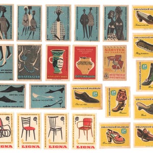 May include: A collection of vintage matchboxes featuring various designs, including a woman in a dress, a pair of shoes, a chair, and a vase. The matchboxes are all rectangular and have a colorful design.