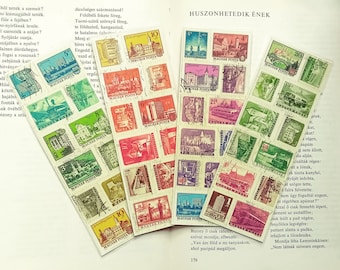 Vier Lesezeichen, Collagen aus Briefmarken. Regenbogen. Städte, Burgen und Busus auf ungarischen vintage Briefmarken. 1960er, 1970er Jahre. Laminiert.