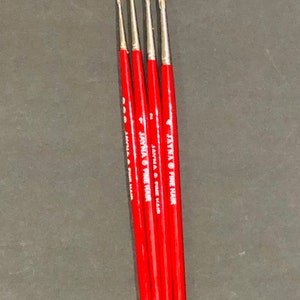 May include: Four red paint brushes with silver tips and the text "JAYMA FINE HAIR" printed on the side of each brush.