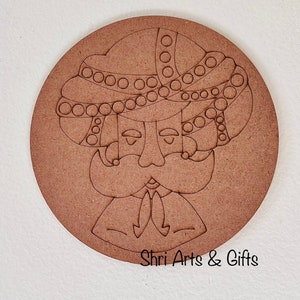 May include: A wooden round craft blank with a line drawing of a man wearing a turban. The man has a mustache and beard. The text "Shri Arts & Gifts" is at the bottom of the blank.