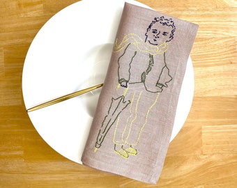 Hand Embroidered Napkin with a man on a walk