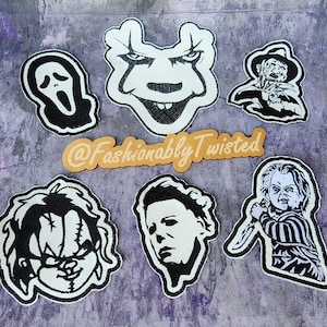 May include: Set of nine black and white iron-on patches featuring horror movie characters. The patches include Freddy Krueger, Jason Voorhees, Michael Myers, and more. The patches are perfect for adding a spooky touch to your clothing, bags, or other accessories.