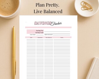 May include: A white savings tracker with pink accents and the text "SAVINGS Tracker." The planner includes sections for saving goals, dates, and notes. A gold pen and a cup of coffee are on the left.