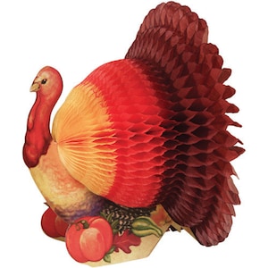 May include: A red, orange, and brown paper turkey decoration with a honeycomb texture. The turkey has a large, round body and a long, thin neck. The turkey is standing on a base with a brown, green, and orange design.