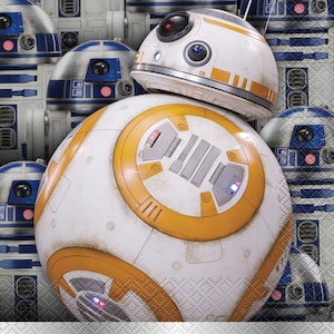 May include: A white and orange spherical droid with a round, white dome on top. The droid has a series of orange stripes and a small, red light on the dome. The droid is surrounded by smaller, blue and white droids.
