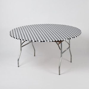 May include: A round folding table with a black and white checkered pattern tabletop. The table has a metal frame and legs. The table is approximately 48 inches in diameter.