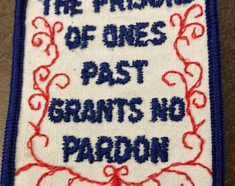 1970s  sew on patch " the prisons of ones past grants no pardon"