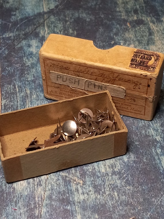 Antique thumb tack box with assorted tacks and old metal lifterUS