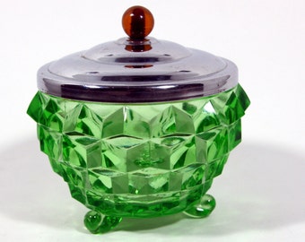 Jeannette green glass powder jar with metal lid-bakelite knob-cubist pattern-tri footed
