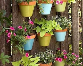 Vertical Gardens Made Easy. Hangapot the hidden flower pot hanger hangs clay pots 4-10” on fences, walls, posts, stumps, Anywhere! EZ DIY.