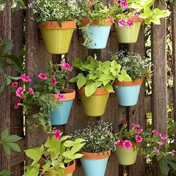 Vertical Gardens Made Easy. Hangapot the hidden flower pot hanger hangs clay pots 4-10” on fences, walls, posts, stumps, Anywhere! EZ DIY.